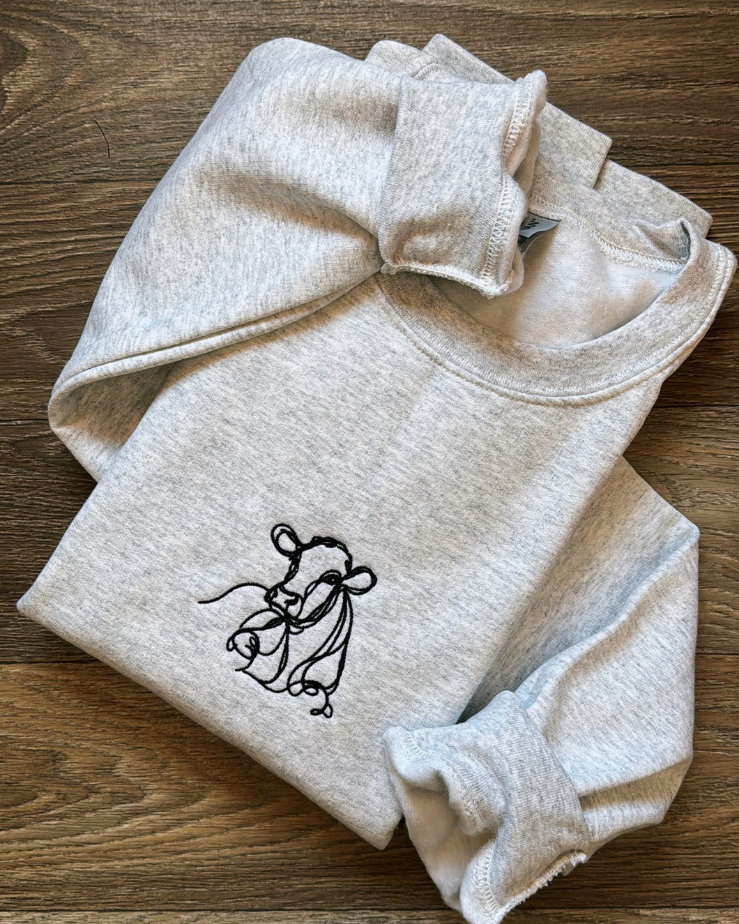 simple line cow sweatshirt